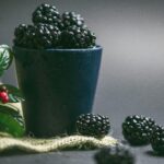 Big blackberries piled up in a cup